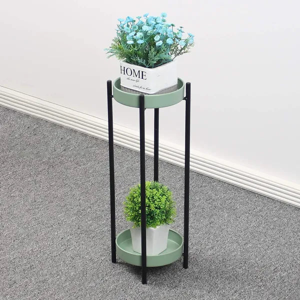 Green metal floor-standing plant stand with a black Stand