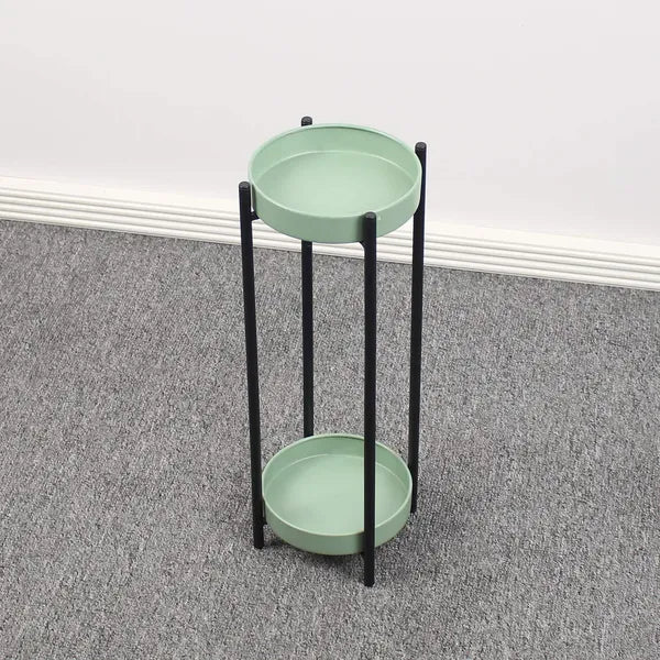 Green metal floor-standing plant stand with a black Stand